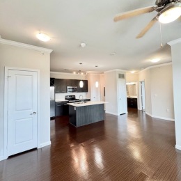 a kitchen with an island and wood floors