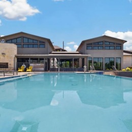 a swimming pool in front of a building