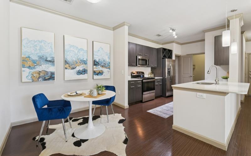 a kitchen with a table and chairs