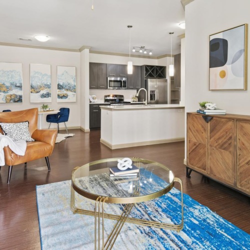 a living room with a table and chairs