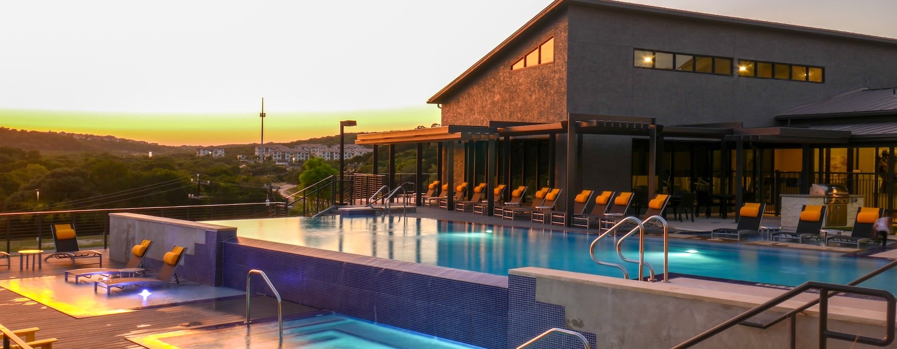 a swimming pool with a building in the background