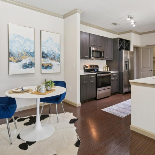 a kitchen with a table and chairs