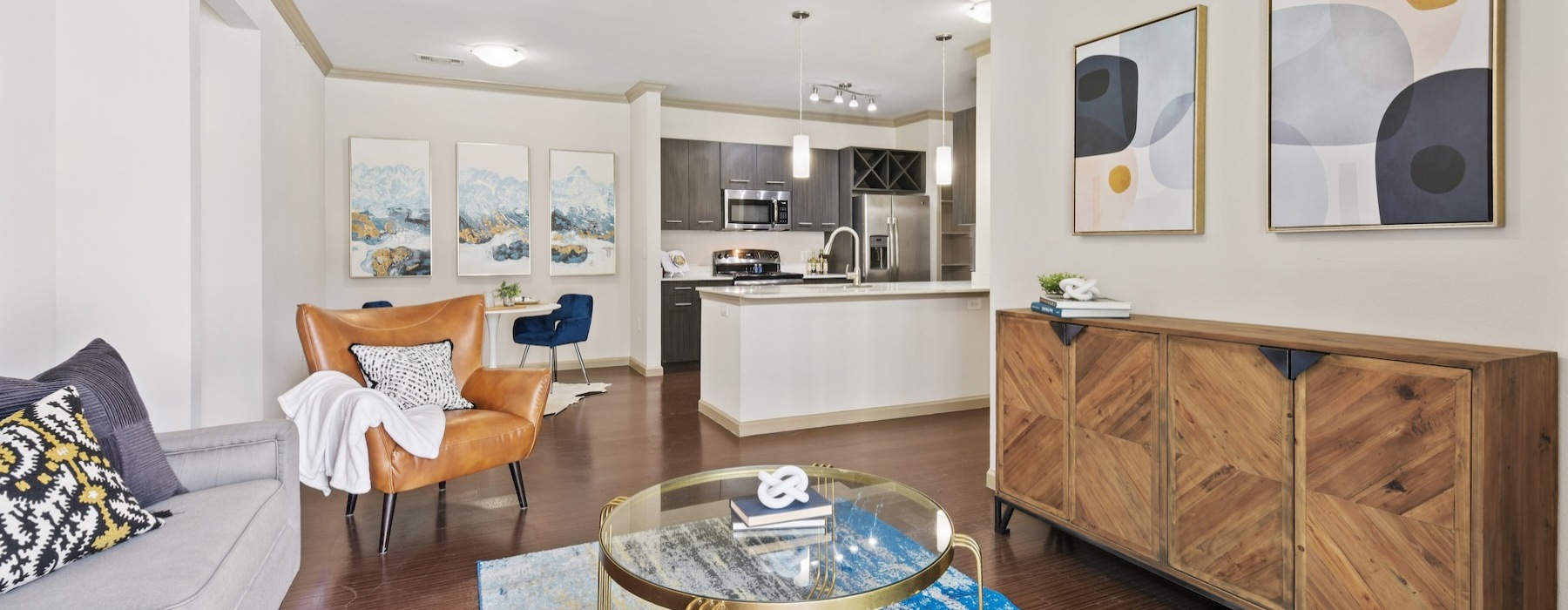 a living room with a table and chairs
